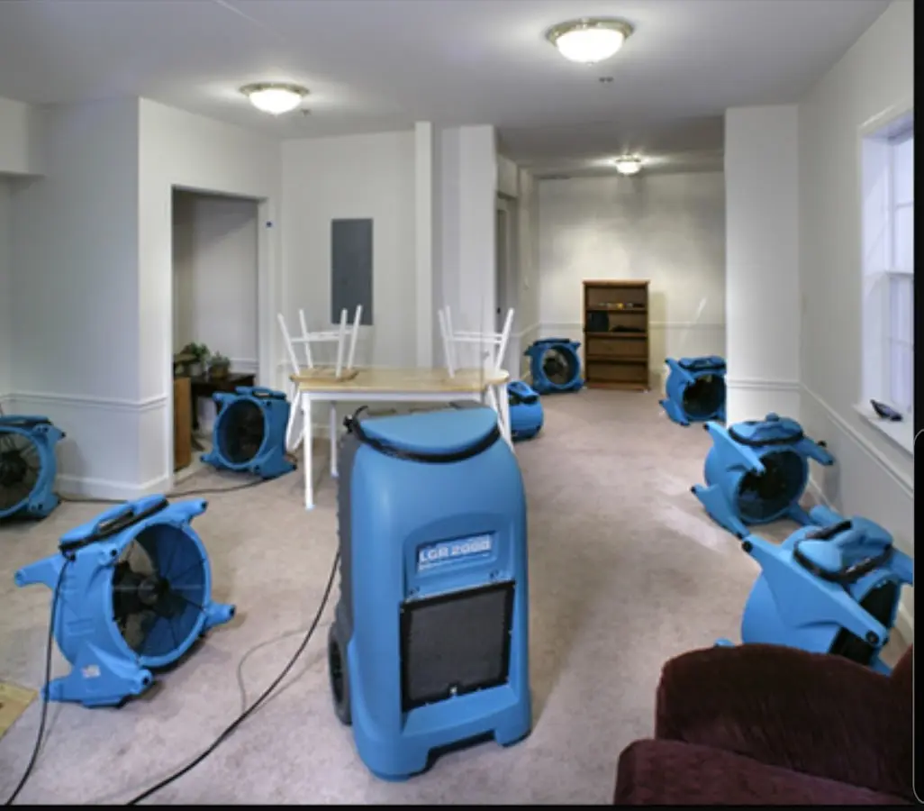 Air movers and dehumidifier setup for Water Damage Restoration in Perry